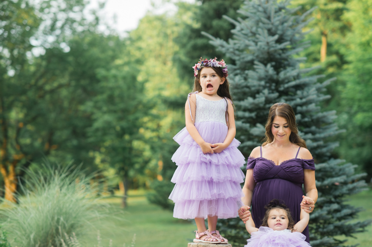 I was thrilled when Michelle from Pink Comb Studio reached out for her maternity photos. Following COVID-19 rule, keeping social distance I photographed Michelle and her two beautiful girls at Watchung Mountain NJ. With overcast weather three trees and grass showed such a rich deep green colors. I love bold rich colors in my photos as much as I love sunset golden hour. Michelle was just glowing and looked so beautiful. Was so happy to have such a beautiful mama in front of my camera before Michelle becomes mama of three girls. I can not wait to see her new baby girl and see her family grow. Michelle Surgent’s maternity session captured by Karis from heykaris.